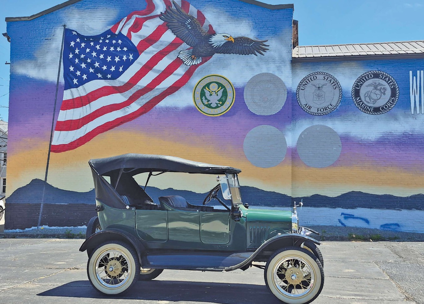 1924 Model T in front of a patriotic mural