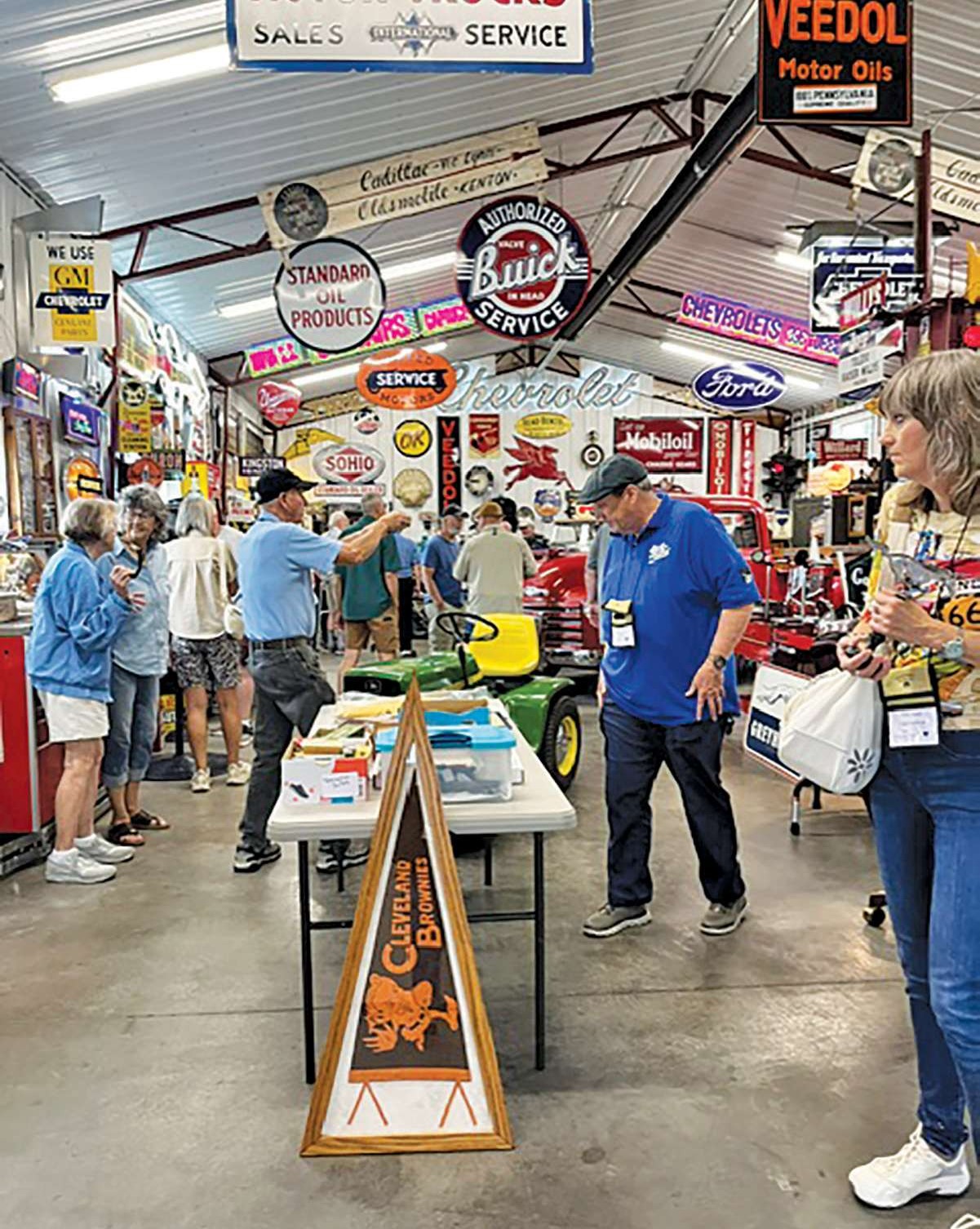 Farm Boys Tour participants inside Linda Houchin's Standard Oil Garage